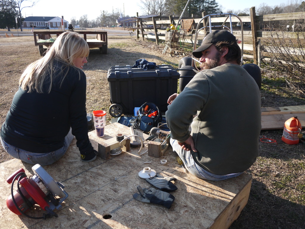 Kimm and Nathan adding the wiring to the fixtures