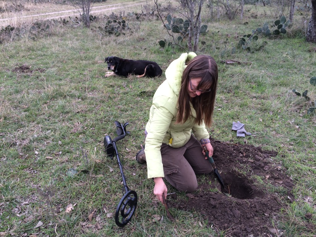 metal detecting for cool old garbage out among the prickly plants