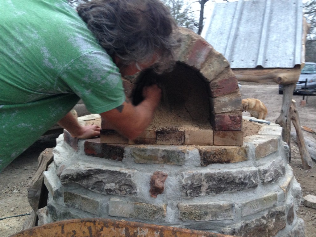 removing sand form, with the roof in the background