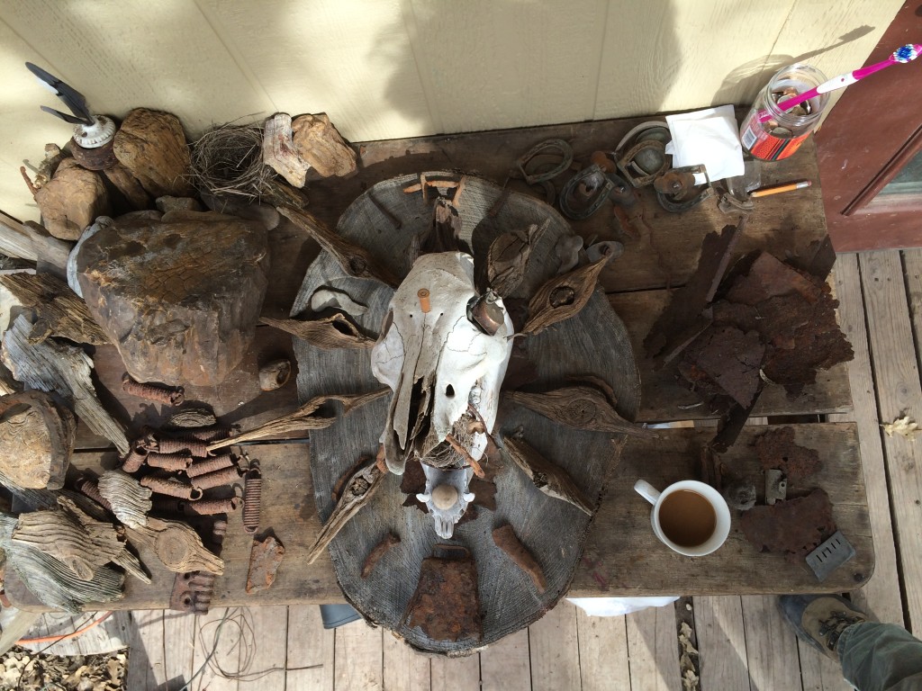 rocks and artifacts and bones outside the cabin