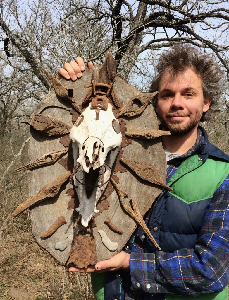 Kingsbury Totem: wild boar skull with homestead bullet, board knots, cow bell, bed spring, melted aluminum blobs, & other artifacts, secured with scraps of old barbed wire etc