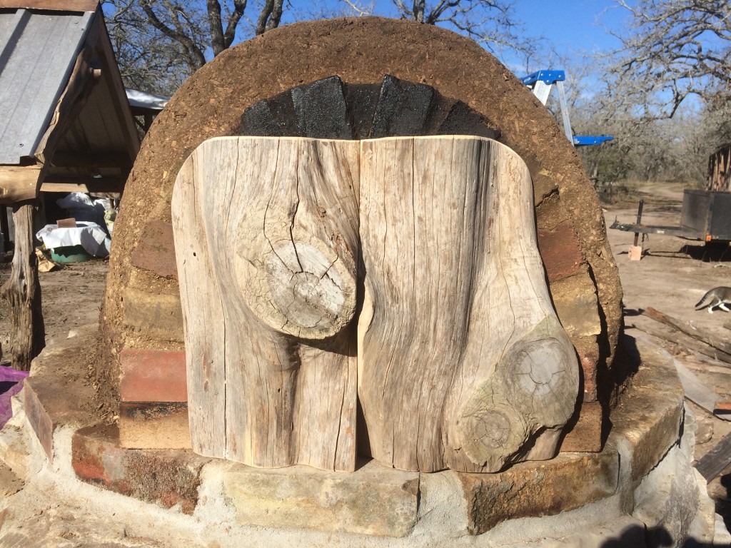 cedar baking door - plugs the entrance, sealing in heat