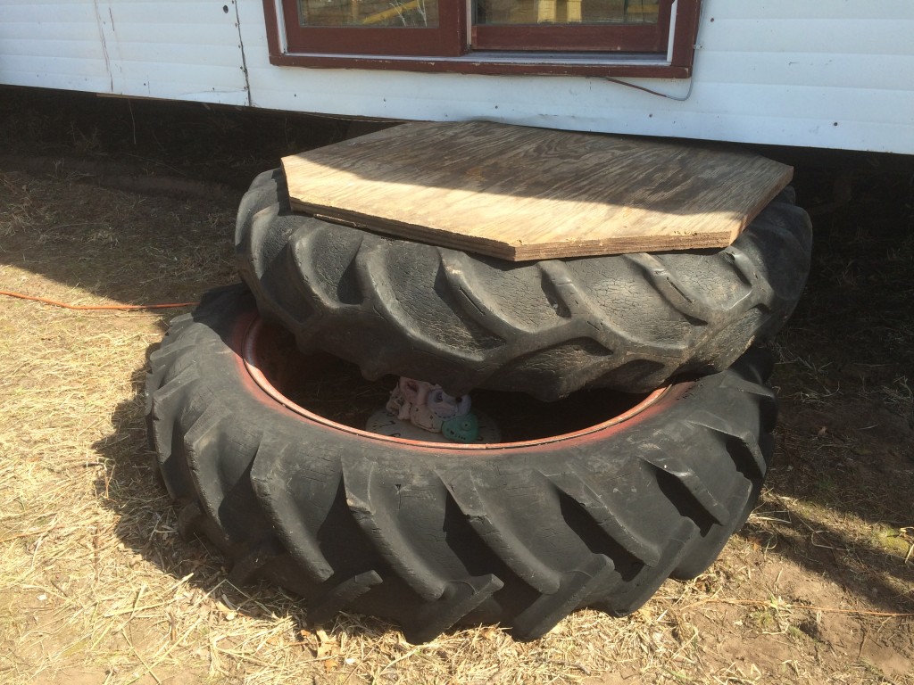 old tractor tires & former tabletop repurposed as front steps