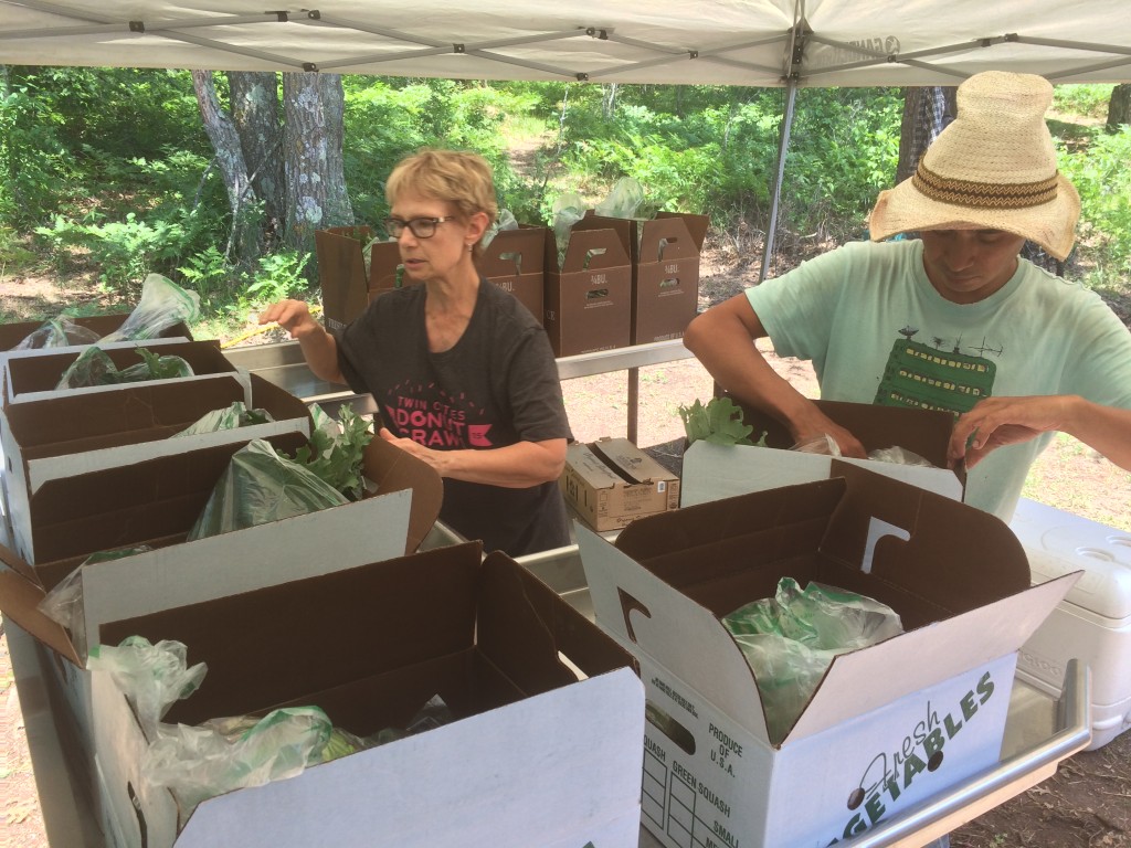 Deb and Reynaldo packing up share boxes