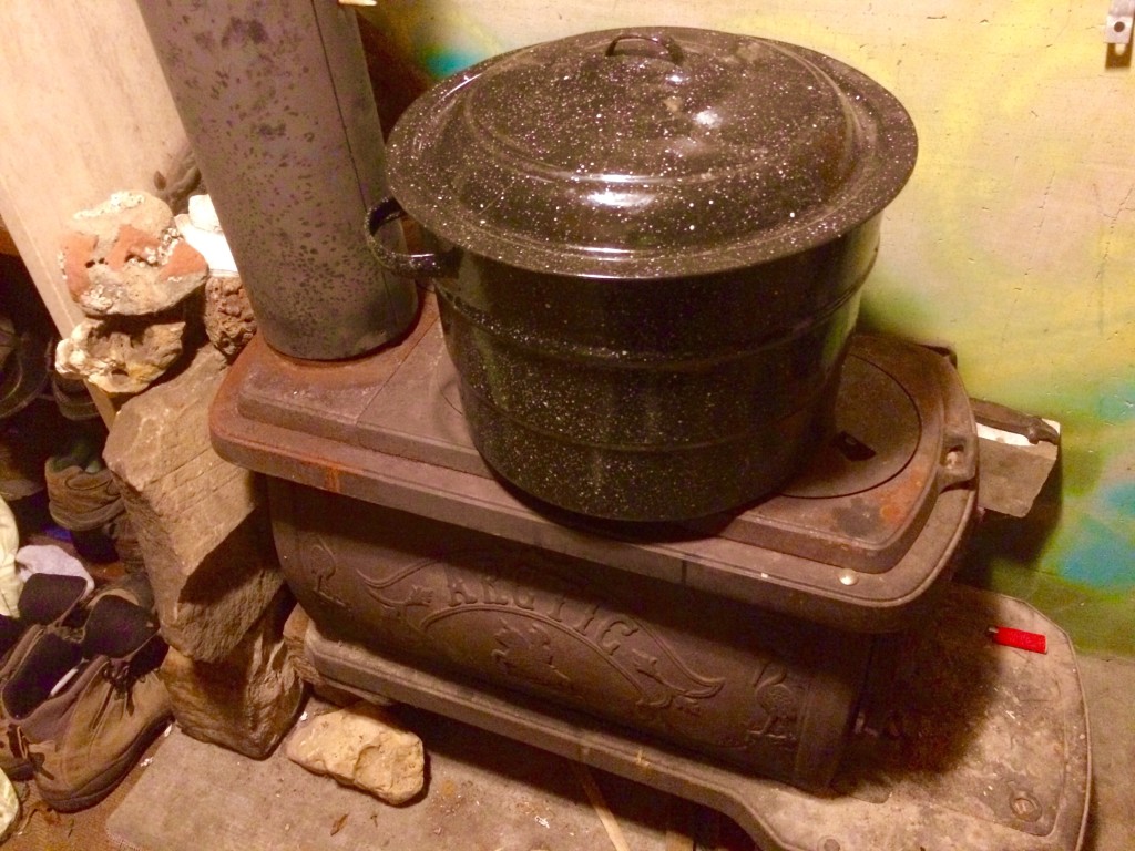 farmer's market prep when mornings are frosty includes getting a pot of water heated on the woodstove overnight - this can be added to a big bucket of icy well water (for cleaning veggies) to bring the temp to merely "cool" from "painfully freezing"