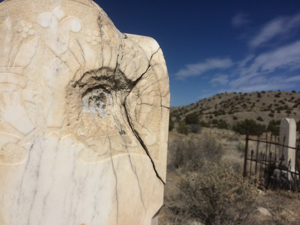 gunshot gravestone in the old Los Cerrillos cemetary