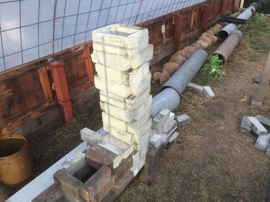 an early mockup, seeing how tall the system would be - and how close we could put it to the curving north all of the greenhouse. (The original plan was for a 8" pipe system, although we switch to a 6" design before building)