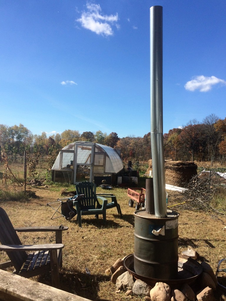 burning the paint off of the 55 gallon drum - so it wouldn't create toxic fumes in the greenhouse later