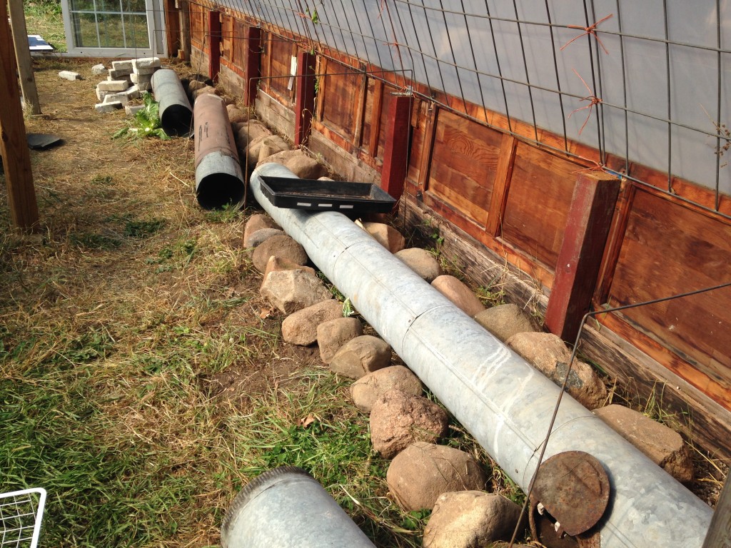 early layout with the larger pipes - determining how many rocks we'd want, how wide it should be for the seed trays, and how deep we'd want to make it,