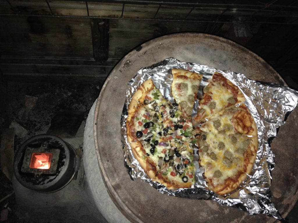 reheating and crisping leftover pizza while firing the mass for the night