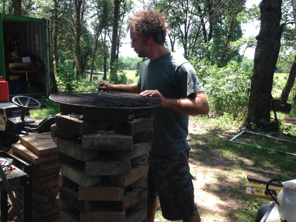 rebuilding the rocket stove grill that the bear destroyed