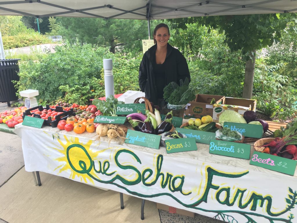 WWOOFer Sarah helped run the Market booth when Kristin had bridesmaid duties to attend to 