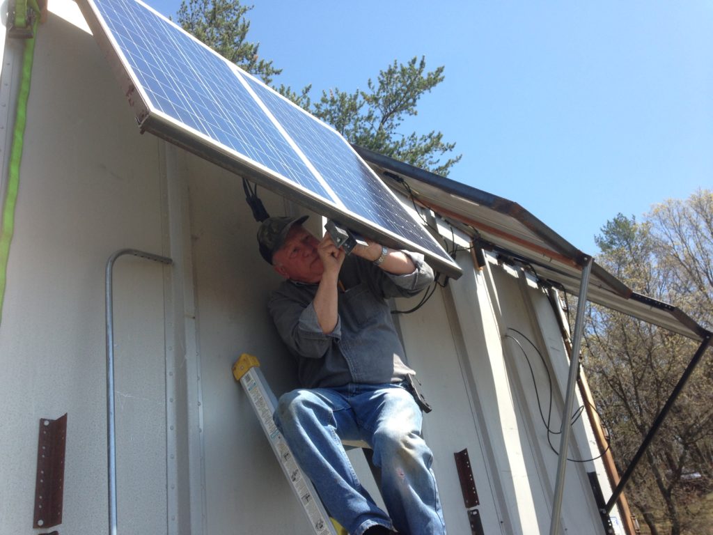 Jim helps install the new solar panels