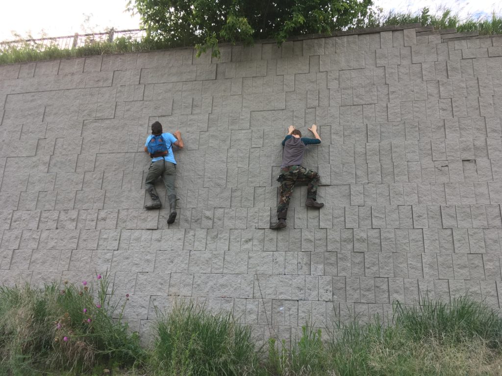 CSA Members Aaron & Robby scale a wall, because it was there.