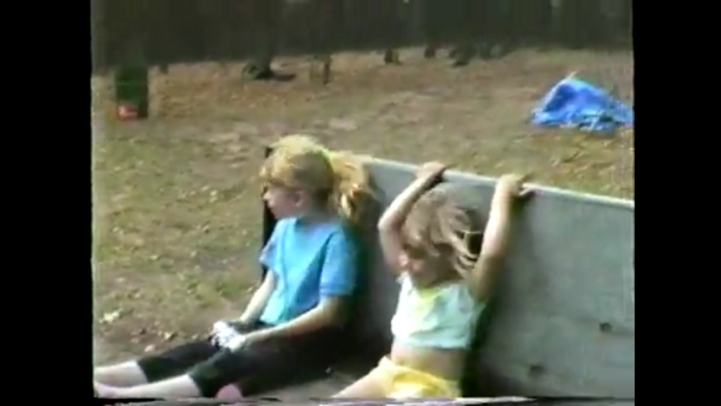 Kristin (right) getting a tractor ride from grandpa on the Farm, back in the 1980s.