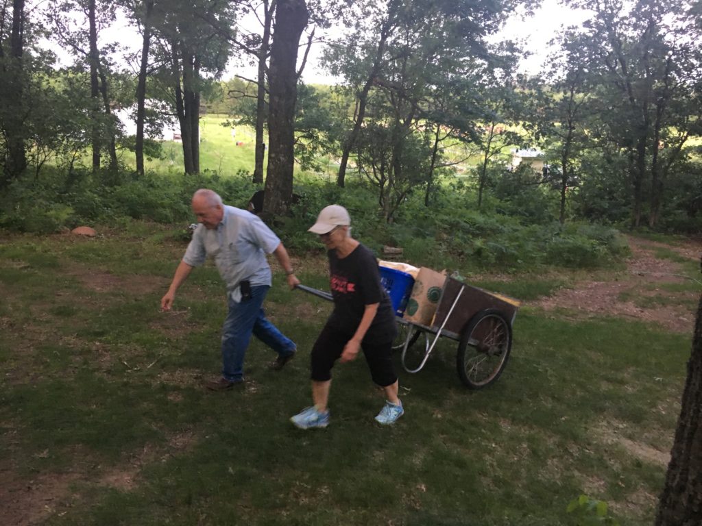 Deb and Jim hauling stuff "upstairs" before the Saturday market